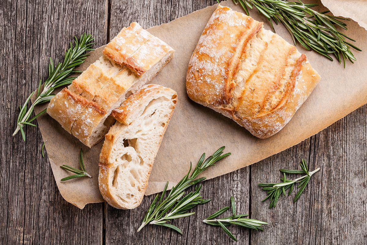 Sliced,Bread,Ciabatta,And,Rosemary,On,Wooden,Background