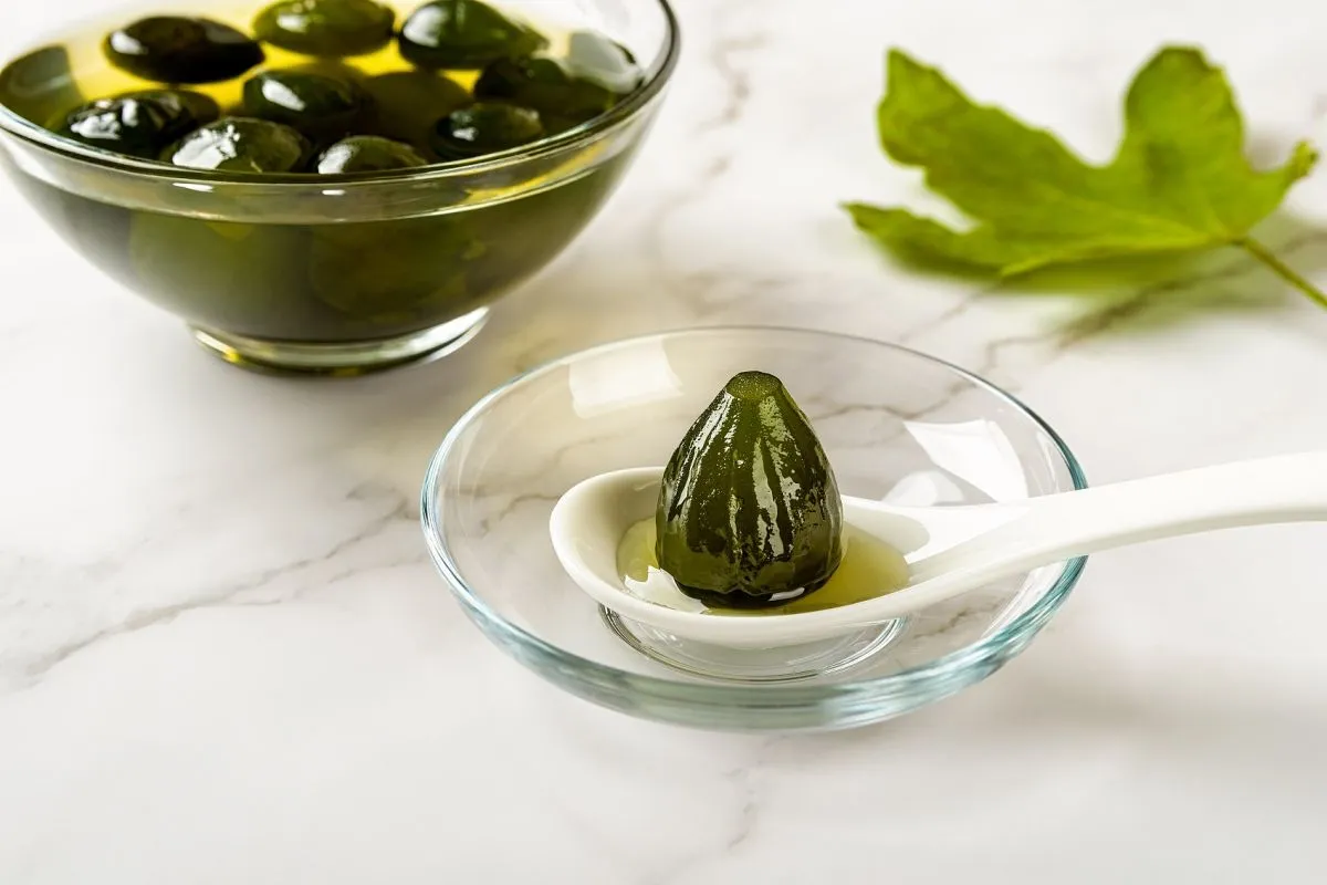 Close-up,Of,Preserved,Whole,Unripe,Fig,On,A,Spoon,Near