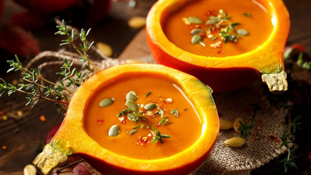Pumpkin,Soup,Served,In,A,Hollowed,Pumpkins