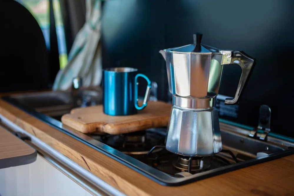 Aqua,Bialetti,Stovetop,Coffee,Maker,And,Mug,,On,A,Van