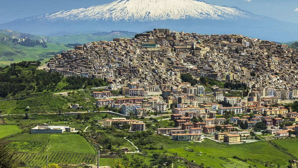 Hill town with backdrop of snowy volcano Mount Etna, Gangi, Palermo Province, Sicily, Italy, Mediterranean, Europe