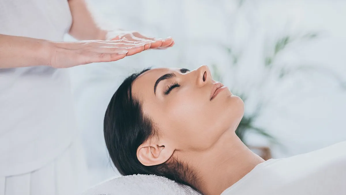 Close-up,View,Of,Peaceful,Young,Woman,With,Closed,Eyes,Receiving