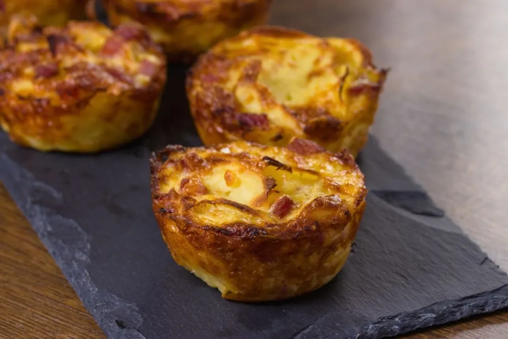 Breakfast,Egg,Muffins,With,Sausage,Served,On,Slate,Serving,Tray