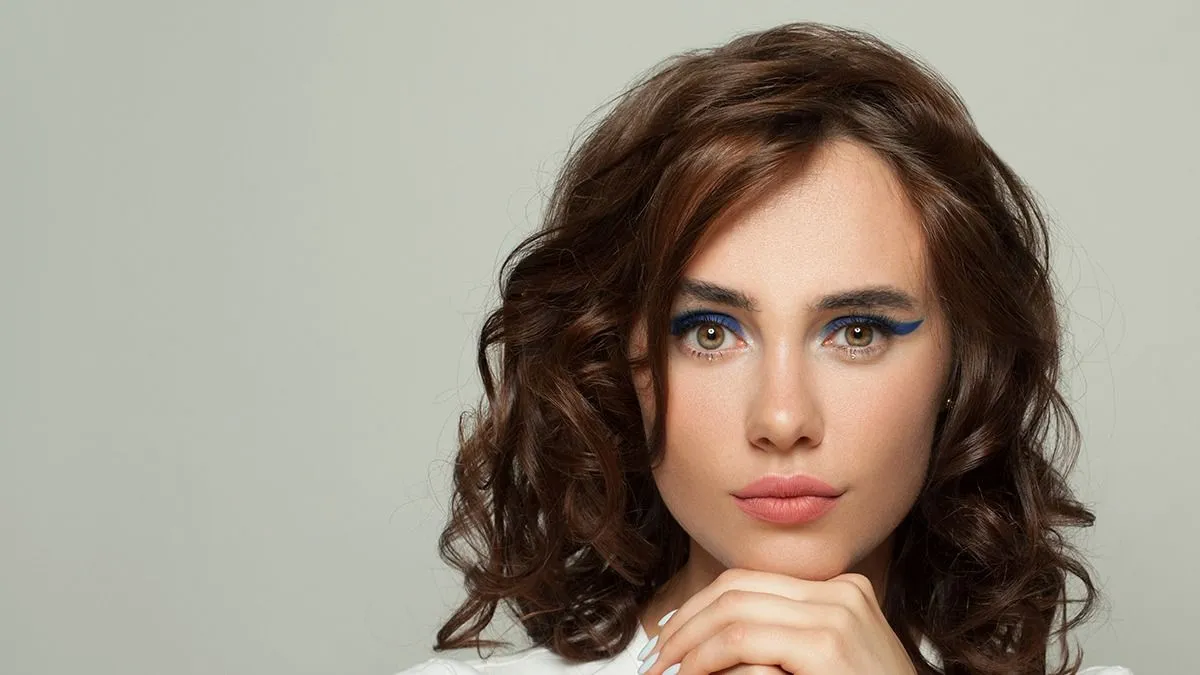 Young,Pretty,Woman,With,Perfect,Curly,Hair,And,Healthy,Clear