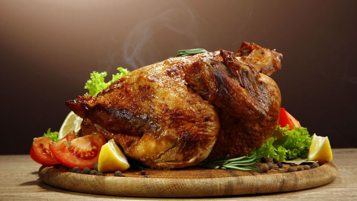 Whole,Roasted,Chicken,With,Vegetables,,On,Wooden,Table,,On,Brown