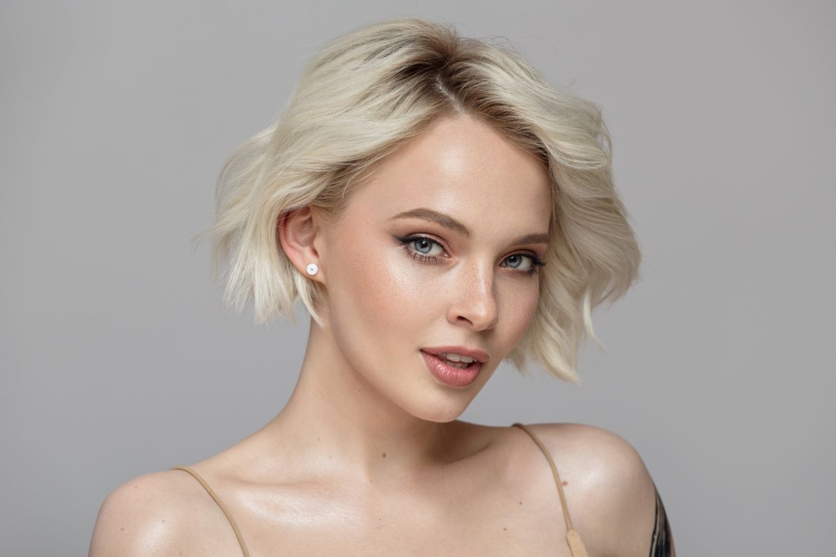 Portrait,Of,A,Beautiful,Blonde,Girl,With,A,Short,Haircut.