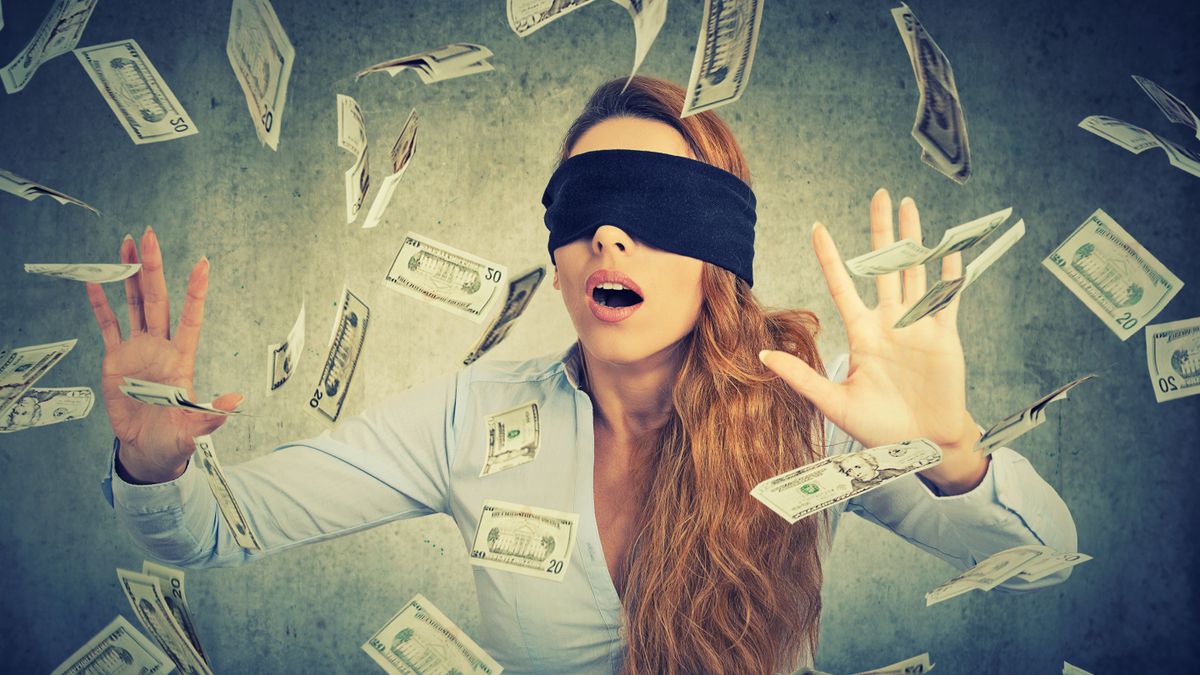 Blindfolded,Young,Entrepreneur,Businesswoman,Trying,To,Catch,Dollar,Bills,Banknotes