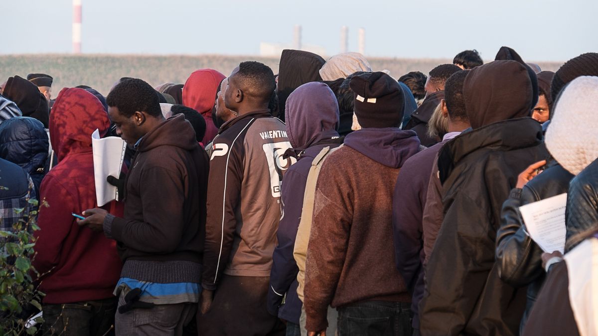 Asylum,Seekers,Wait,To,Leave,The,Jungle,Camp,,Calais,,France.