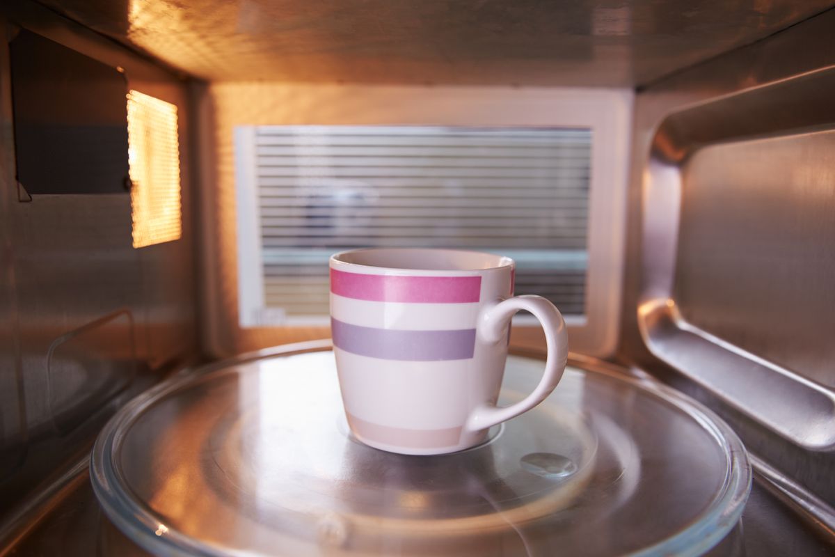 Warming,Cup,Of,Coffee,Inside,Microwave,Oven