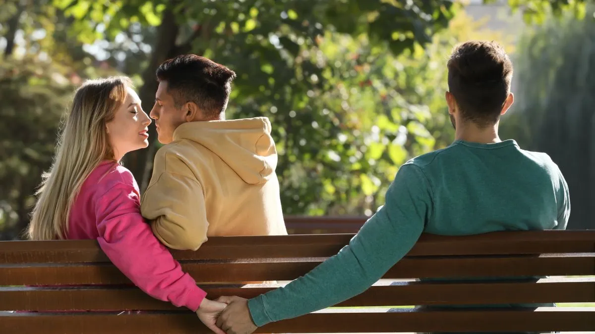 Woman,Holding,Hands,With,Another,Man,Behind,Her,Boyfriend's,Back