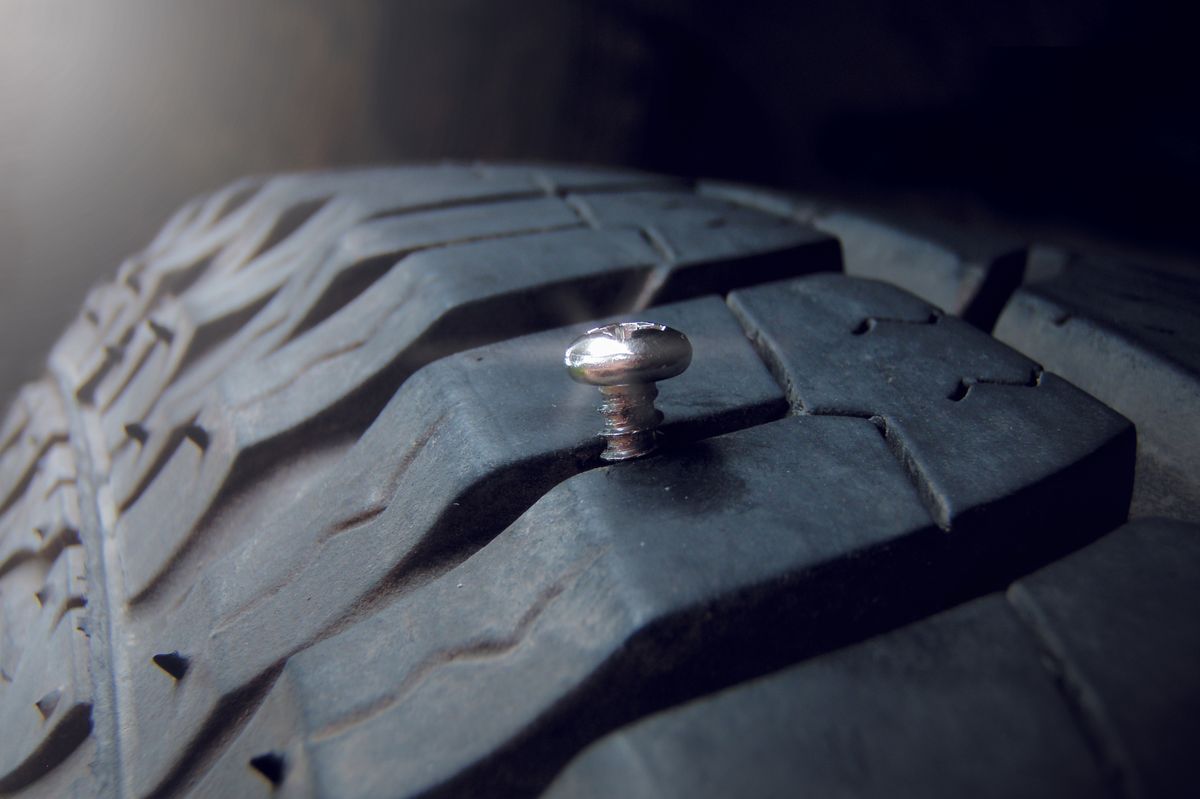 Deep,Embedded,Of,Screw,Nail,On,The,Tire