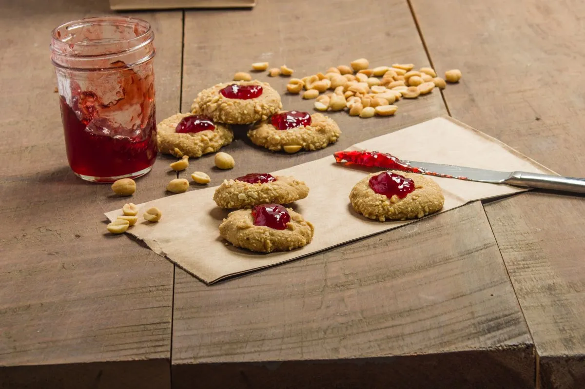 Peanut,Butter,Cookies,With,Strawberry,Jam,On,Wooden,Table