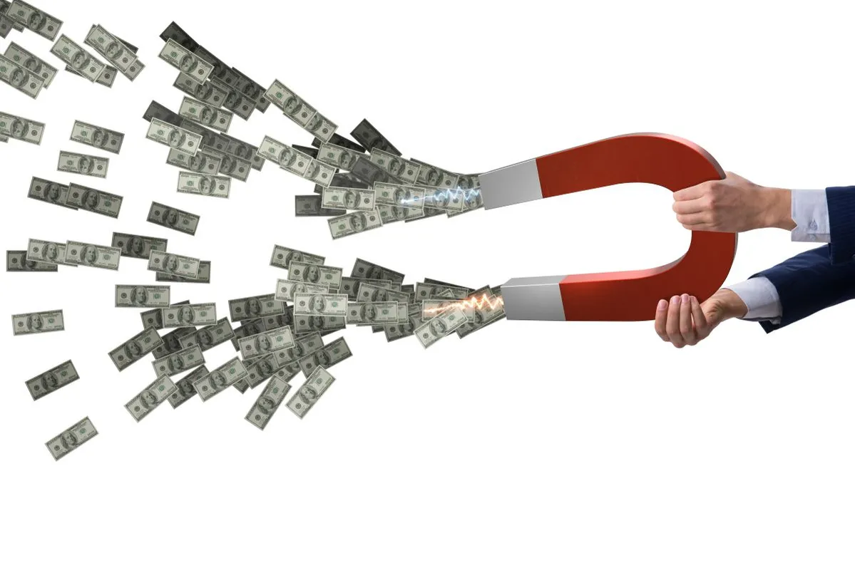 Businessman,Catching,Dollars,On,Horseshoe,Magnet