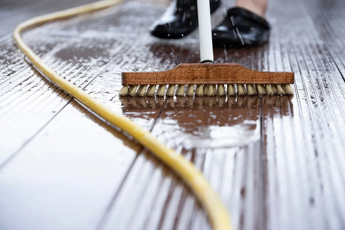 Detail,Of,A,Man,With,A,Scrubbing,Brush,And,A