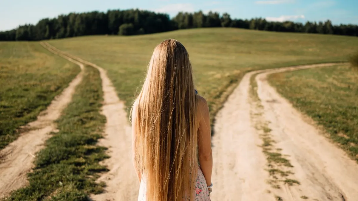 Woman,In,Front,Of,Two,Roads,Thinking,Deciding,Hoping,For