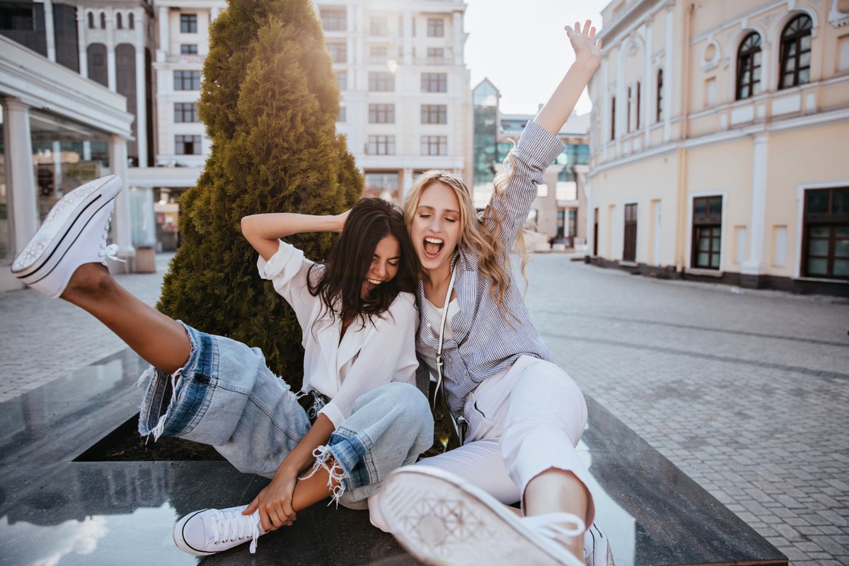 Laughing,Brunette,Woman,Having,Fun,With,Her,Best,Friend,In