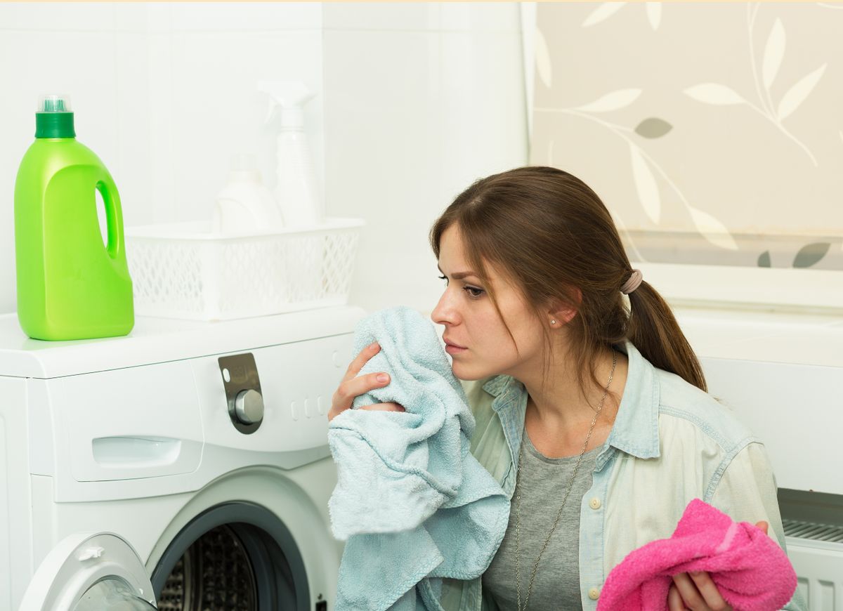 Beautiful,Young,Girl,Doing,Laundry,At,Home