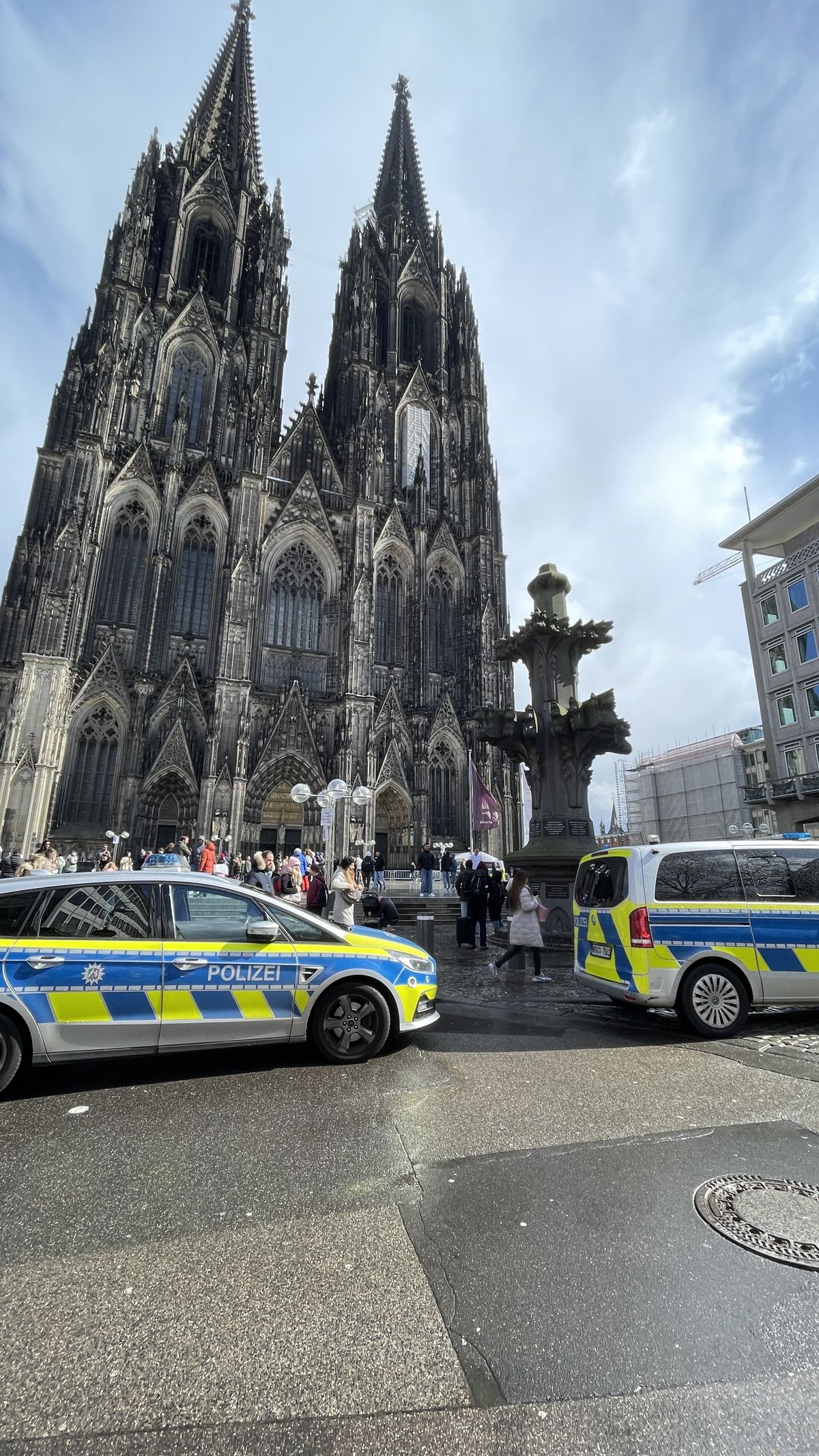 Activists scale Cologne Cathedral scaffolding, unfurl banners
