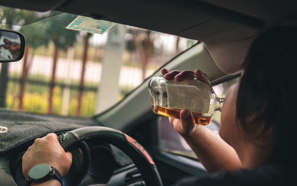 Man,Drinking,Alcohol,While,Driving,In,His,Car