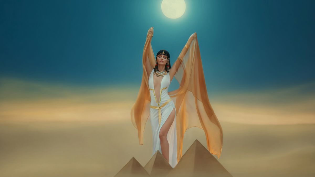 Fantasy,Photo.,Egyptian,Beauty,Goddess,Cleopatra.,Woman,Raises,Hands,To