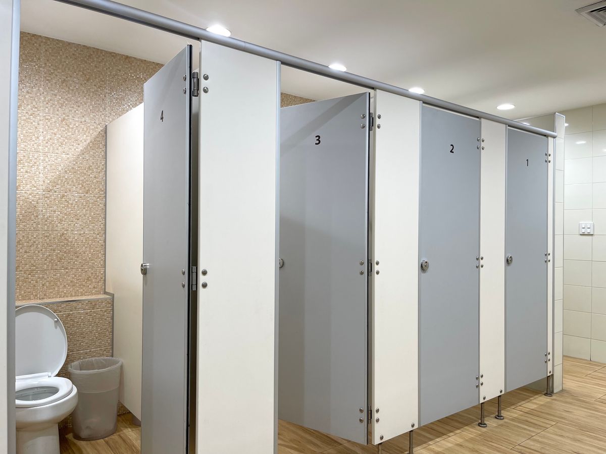 Row,Of,Public,Toilet,Decoration,With,Wooden,Partition