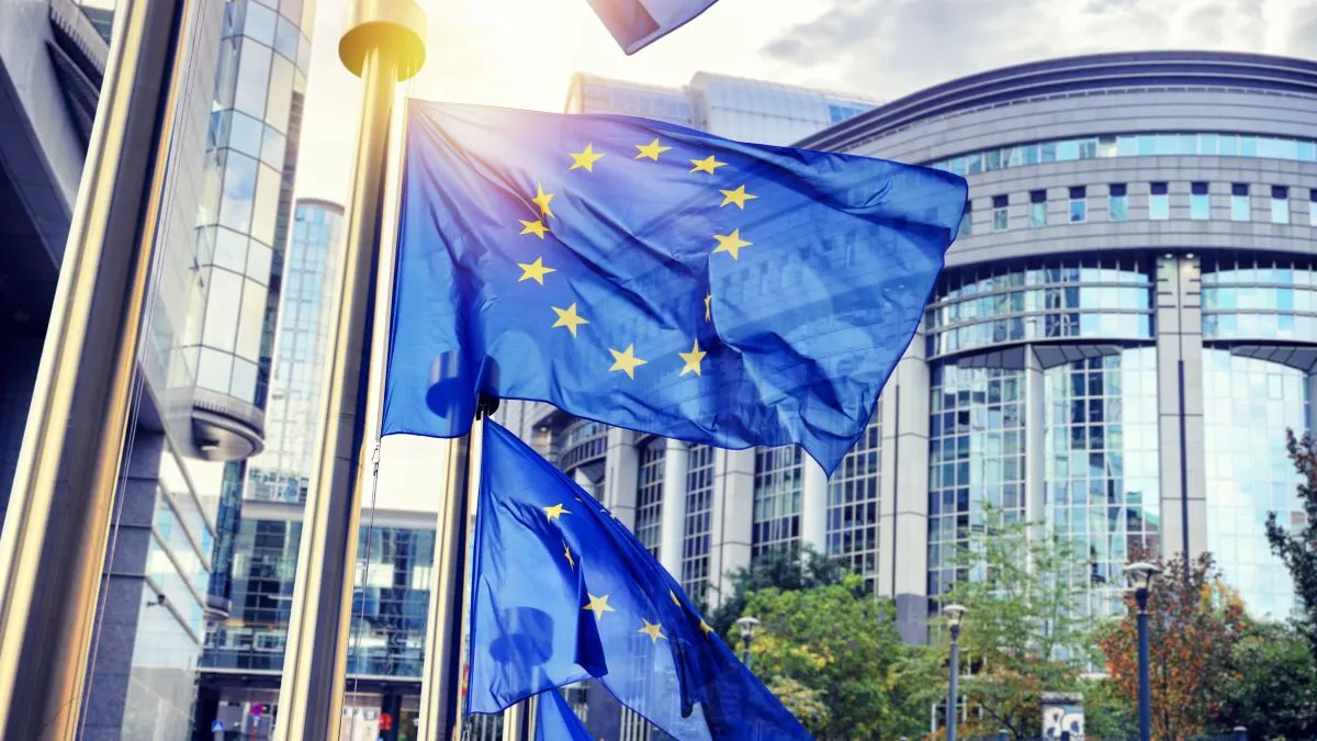 Eu,Flags,Waving,In,Front,Of,European,Parliament,Building.,Brussels,