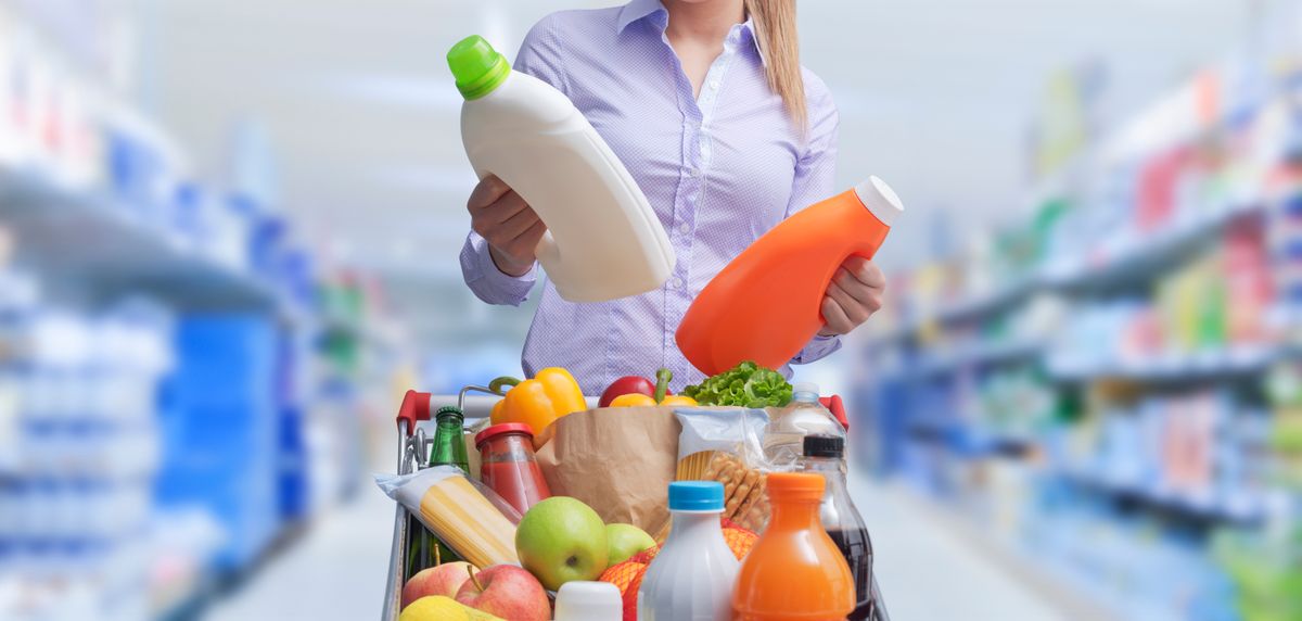 Woman,Doing,Grocery,Shopping,At,The,Supermarket,And,Comparing,Products,
