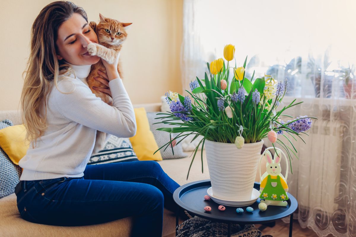 Easter,Celebration,At,Home.,Happy,Woman,Hugs,Cat,Relaxing,On