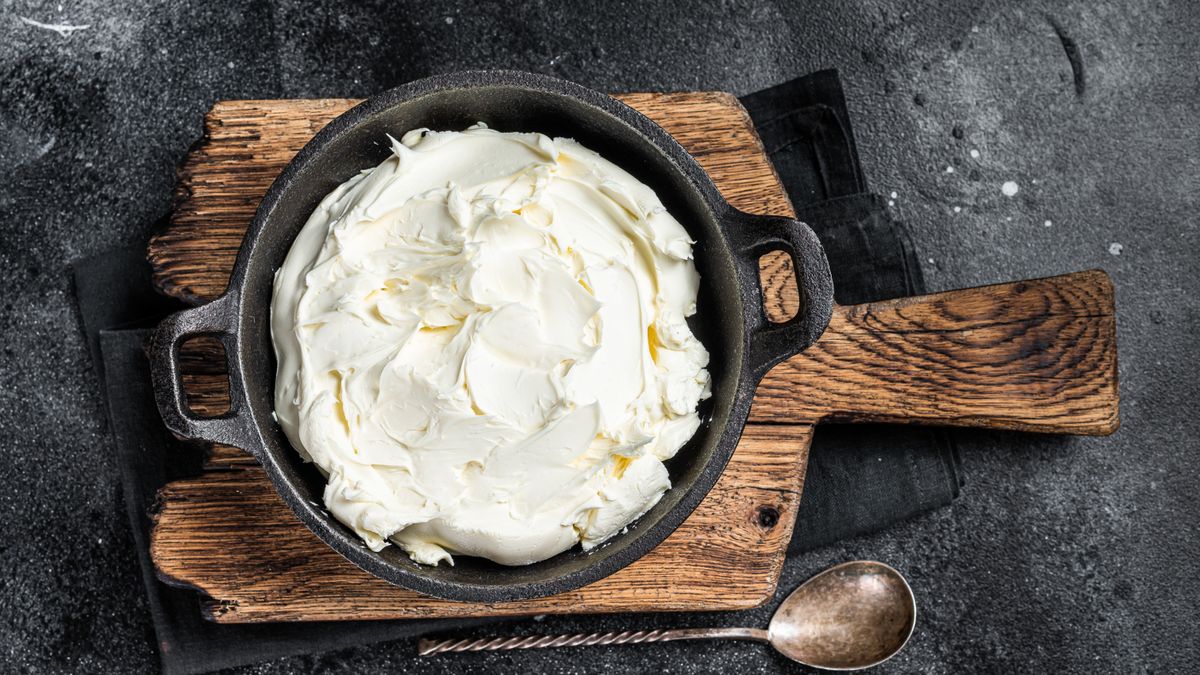 Mascarpone,Cream,Cheese,In,A,Pan,For,Tiramisu.,Black,Background.