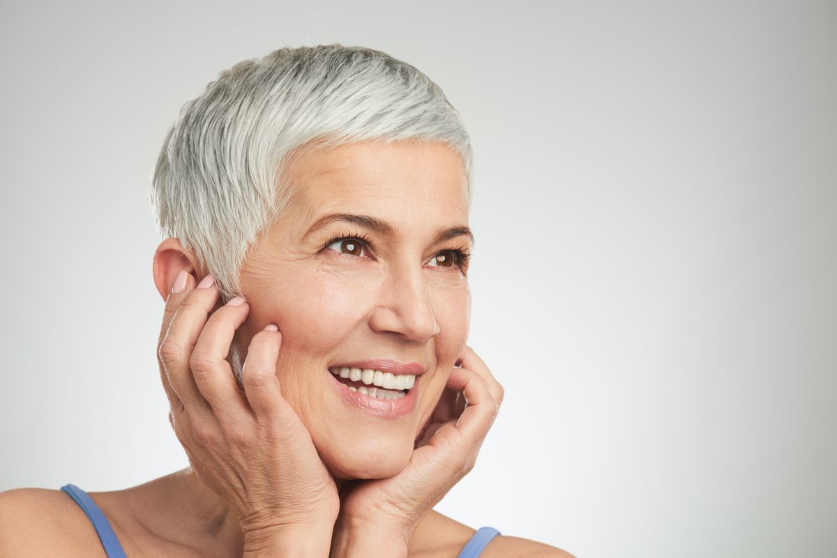 Portrait,Of,Beautiful,Senior,Woman,In,Front,Of,White,Background.