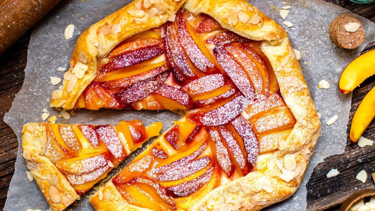 Homemade,Tasty,Galette,With,Peaches,,Nectarines,,Almond,Petals,On,Parchment