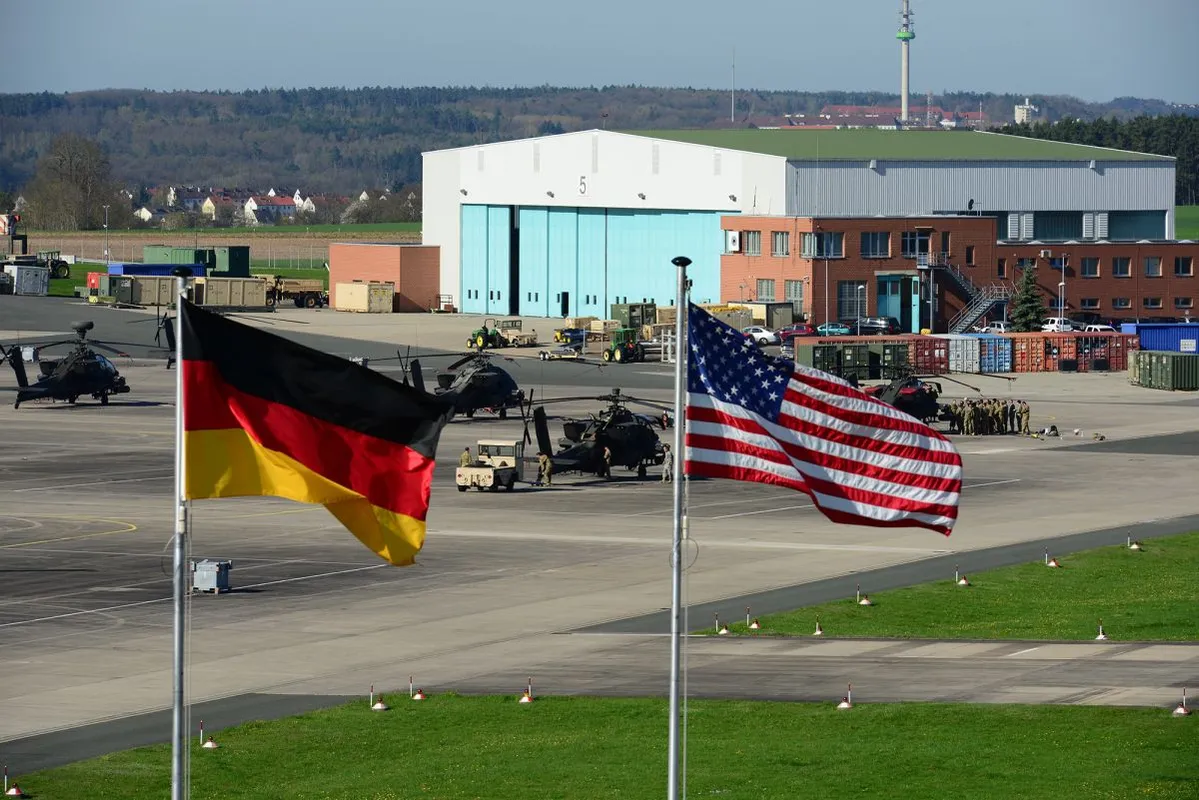 US and German flags fly outside 12th Combat Aviation Brigade Headquarters