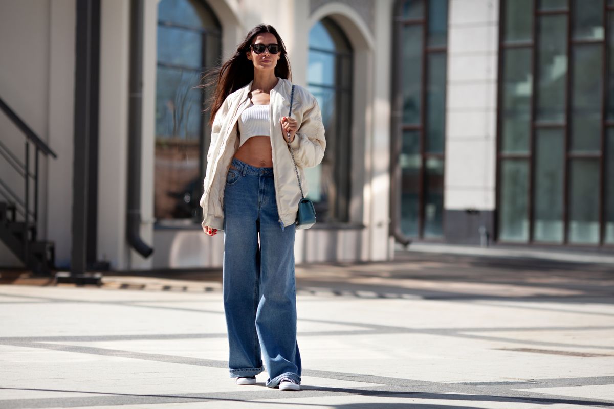 Fashionable,Woman,With,Long,Flowing,Hair,Wearing,Trendy,White,Bomber