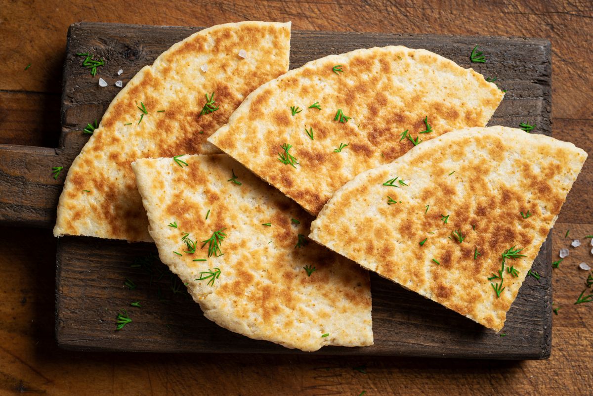 Pita,Bread,On,Wooden,Background,,Top,View.,Georgian,Or,Arabian