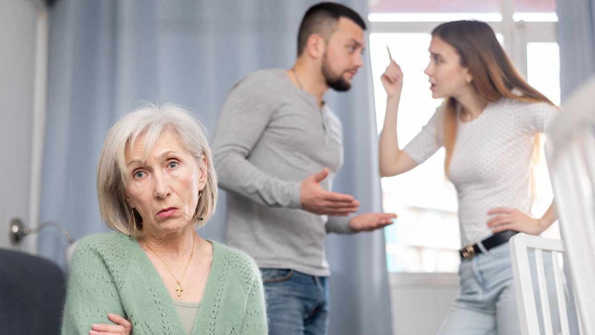 Old,Woman,Ignoring,Her,Daughter,And,Son-in-law,Standing,Behind,And