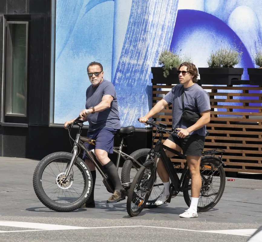 EXCLUSIVE: Arnold Schwarzenegger is Spotted on a Bike Ride With His Son Joseph Baena in Toronto.