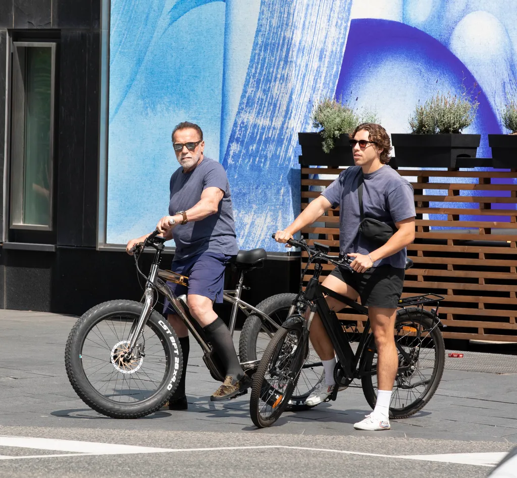EXCLUSIVE: Arnold Schwarzenegger is Spotted on a Bike Ride With His Son Joseph Baena in Toronto.