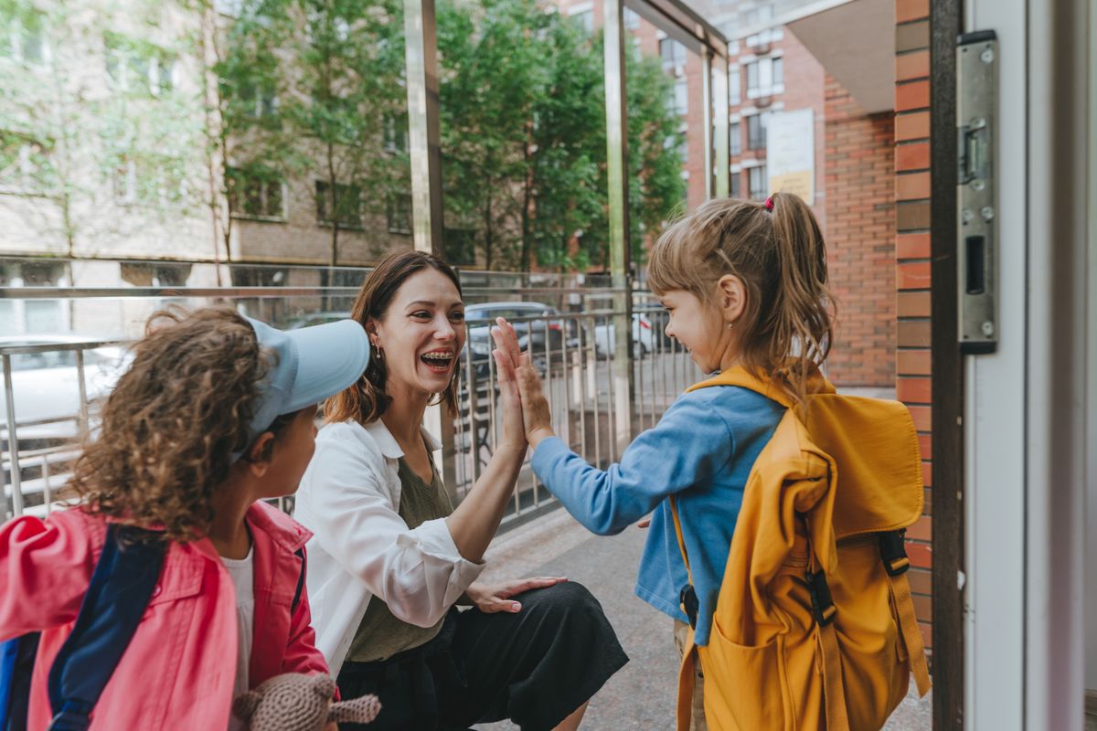 Happy,Smiling,Woman,Teacher,Greeting,Elementary,School,Students,Giving,High