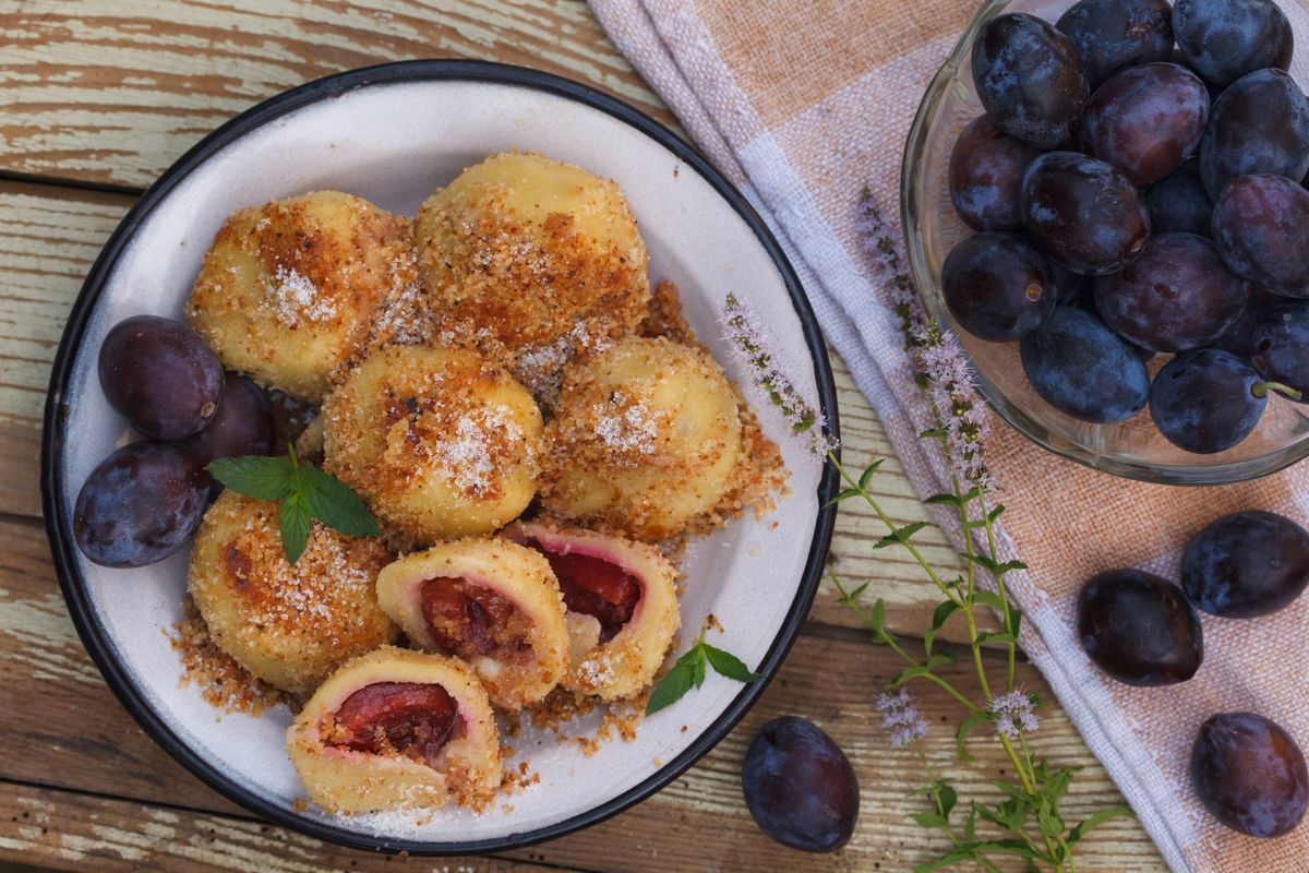 Sweet,Plum,Dumplings,In,Metal,Bowl,On,Wooden,Table.,Homemade