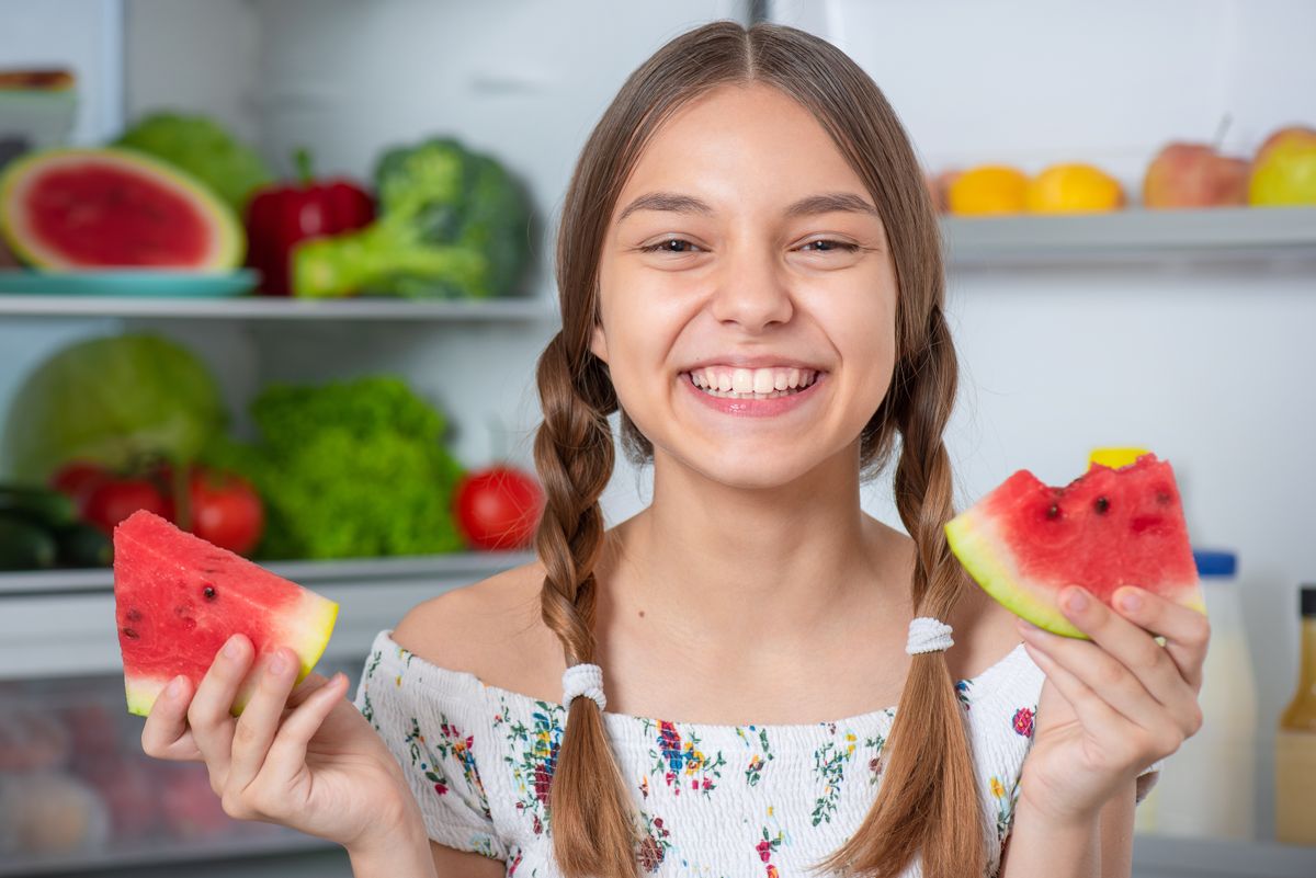 Beautiful,Young,Teen,Girl,Holding,Slice,Ripe,Red,Juicy,Watermelon