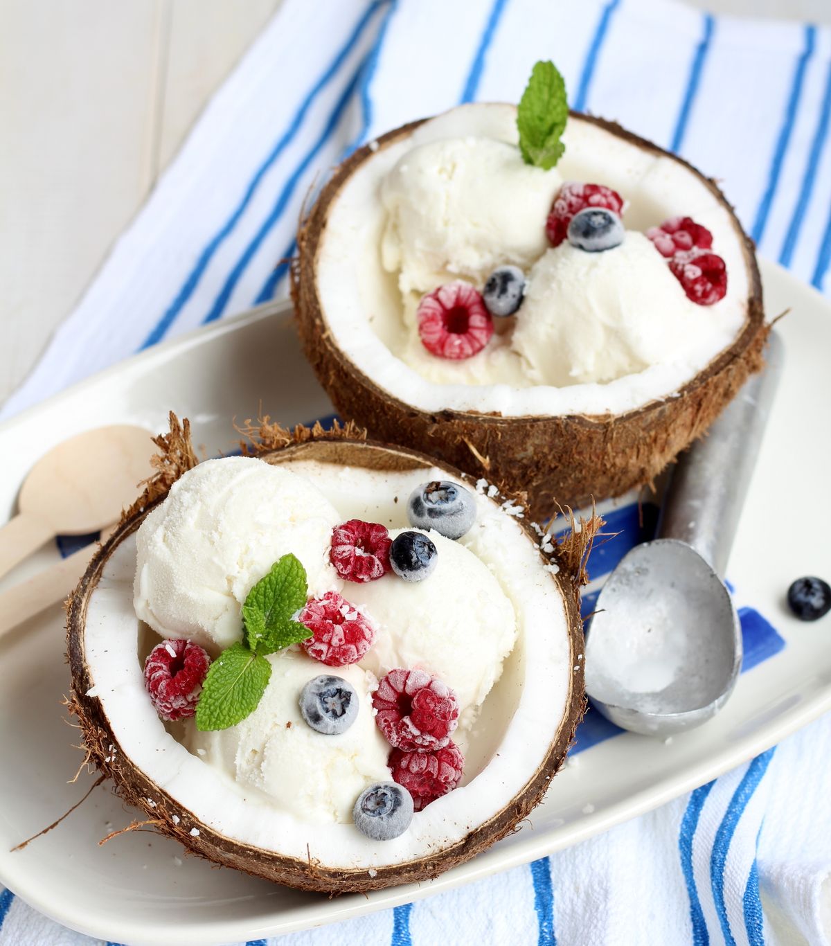 Coconut,Ice,Cream,In,Coconut,Halves,With,Fresh,Berries