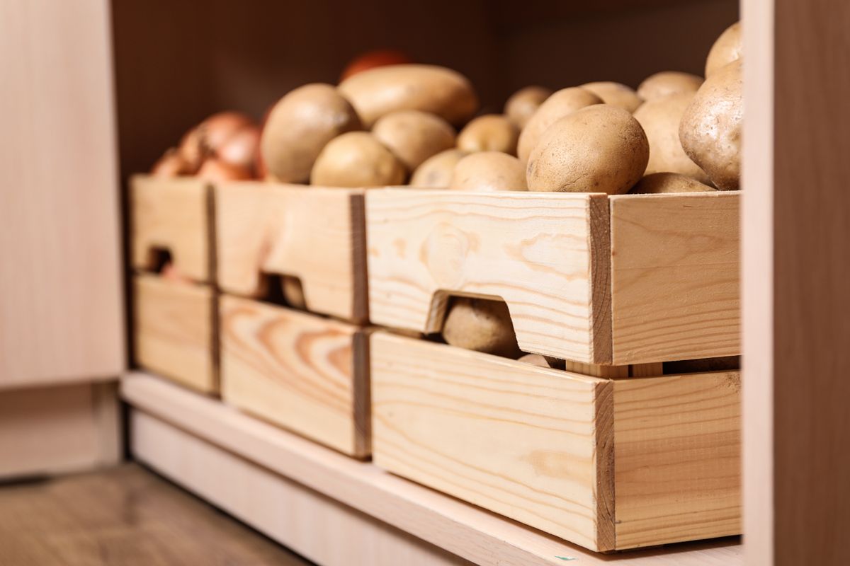 Crates,With,Potatoes,On,Shelf,,Closeup.,Orderly,Storage