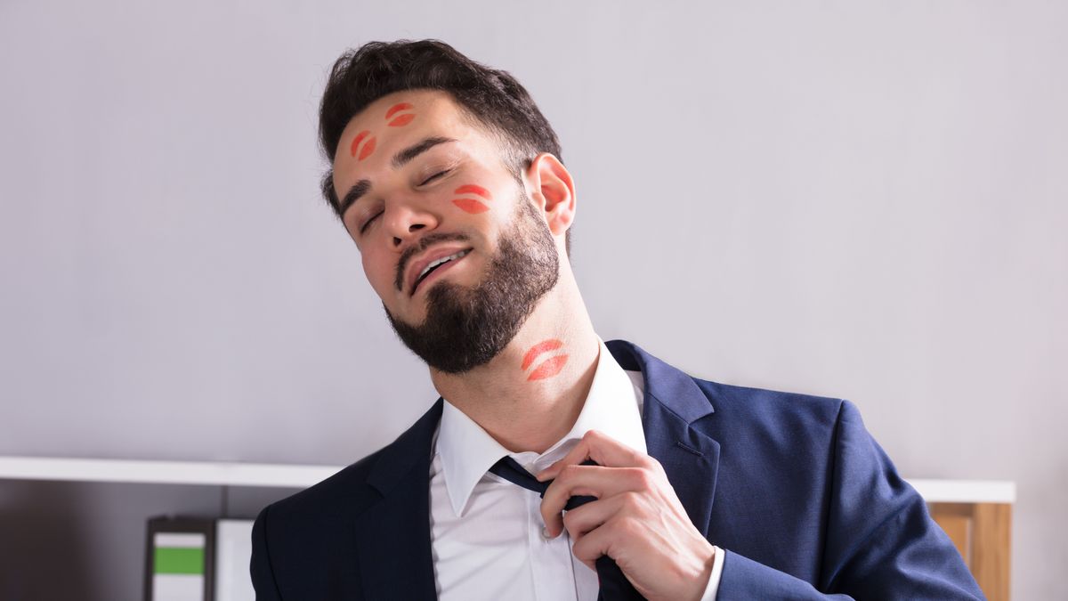 Close-up,Of,A,Young,Businessman,With,Lipstick,Kiss,Marks,On