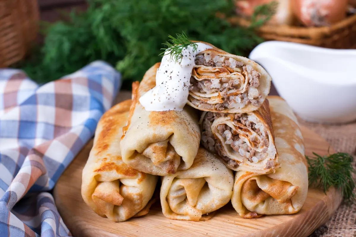 Pancake,Breakfast.,Pancakes,With,Meat,Stuffing,,Served,With,Sour,Cream