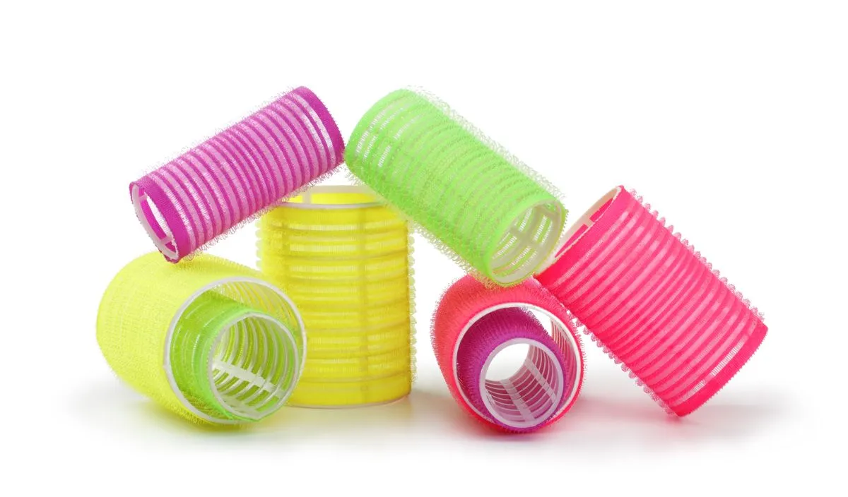 A,Stack,Of,Yellow,Hair,Rollers,Isolated,On,A,White