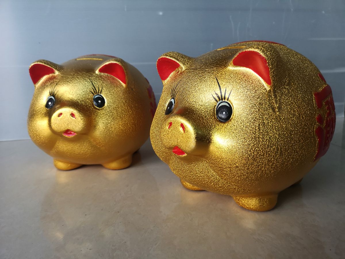 Chinese,Gold,Piggy,Bank,On,Background.