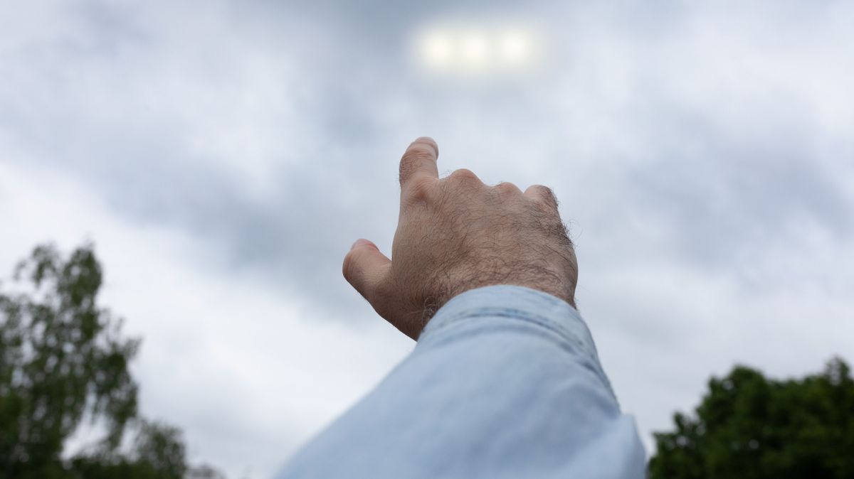 Man,Pointing,Finger,At,The,Strange,Lights,In,The,Sky,