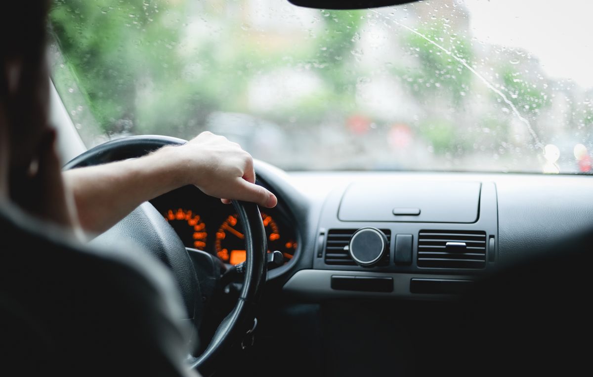 A,Young,Caucasian,Guy,Keeps,His,Hand,On,The,Steering