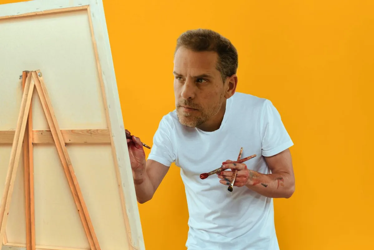 Male artist stands in front of easel emotions drawing Creative approach yellow