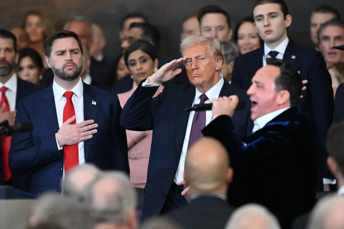 (L-R) US Vice President JD Vance and President Donald Trump stand as US singer Christopher Macchio performs "The Star-Spangled Banner" after Trump was sworn in as the 47th US President in the US Capitol Rotunda in Washington, DC, on January 20, 2025. (Photo by SAUL LOEB / POOL / AFP)